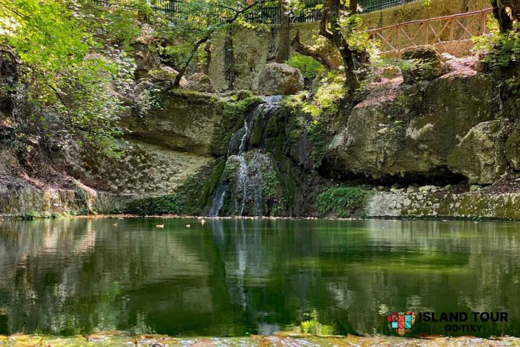 Waterfall and green pond in the Valley of the Butterflies, part of Butterflies Valley Tours in Rhodes.