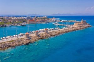 Mandraki Harbour and Rhodes Town connected by Rhodes transfers.