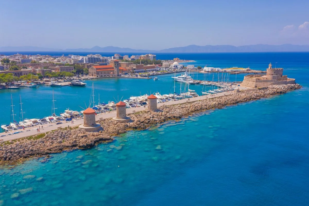 Mandraki Harbour and Rhodes Town connected by Rhodes transfers.
