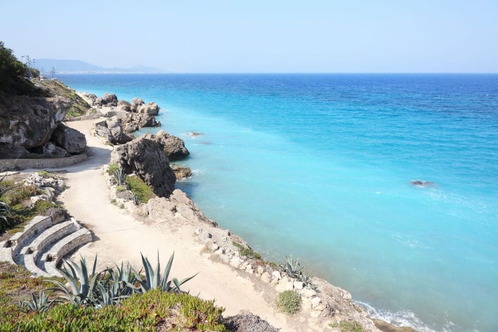 Mandraki Harbour and medieval landmarks in Rhodes with kids on a family sightseeing trip.