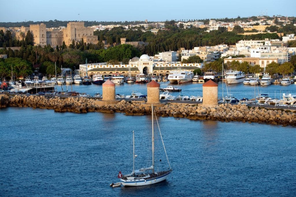 Lindos village and beach in Rhodes with kids enjoying a family day trip.