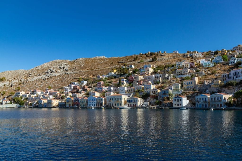 Colorful waterfront houses seen during a Symi Island Day Trip from Rhodes.
