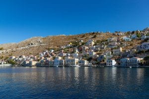 Colorful waterfront houses seen during a Symi Island Day Trip from Rhodes.