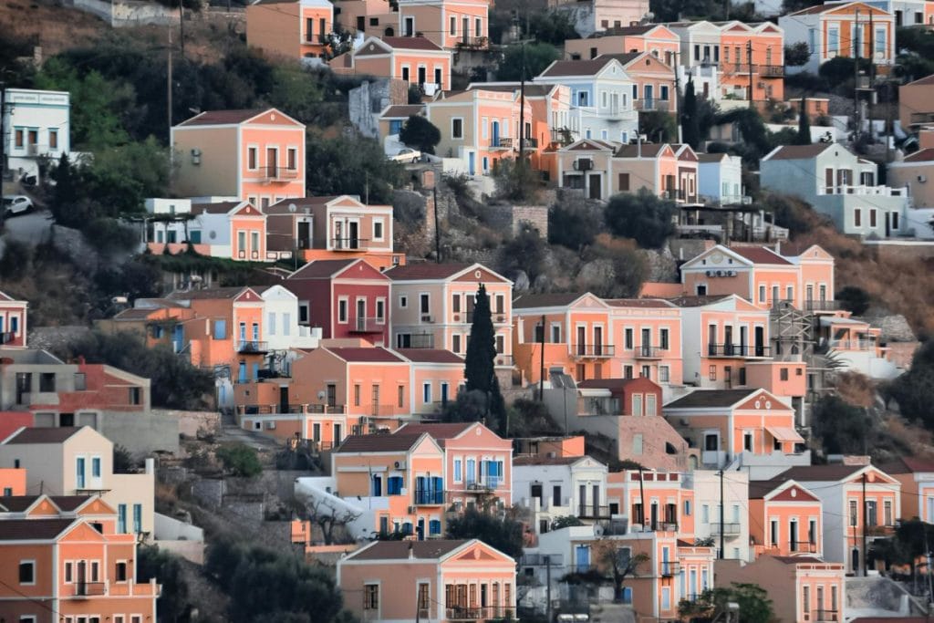 Panoramic harbor and hillside town during a Symi Island Day Trip from Rhodes.