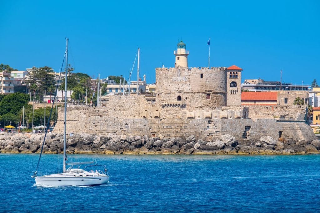 Mandraki Harbour and Saint Nicholas Fortress featured in audio guide tours in Rhodes.