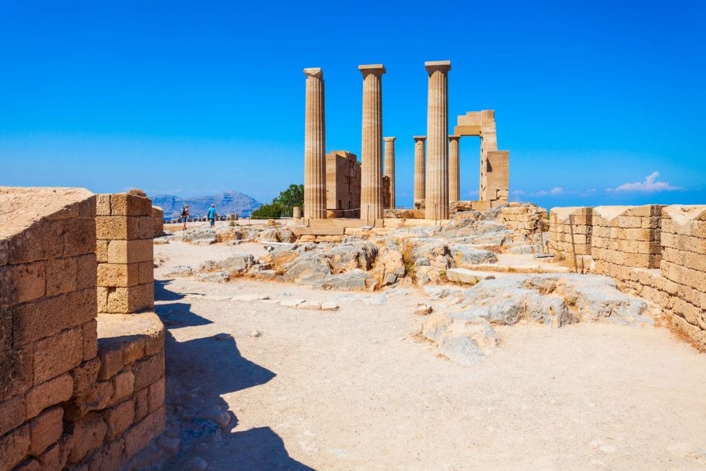 Ancient columns of the Acropolis of Lindos during a half-day in Rhodes excursion.